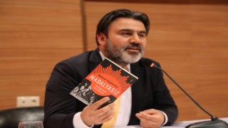 Gazeteci Uluğtürkan'ın ''Madalyasız'' Romanı Bilimsel Dergide