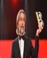 Ercüment Ovalı kimdir